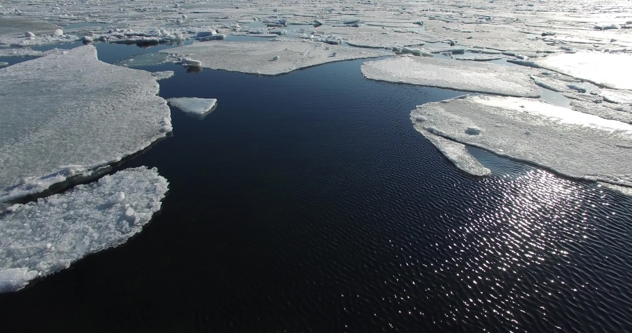 Flying over Arctic Ice Floes. Royalty-Free Stock Footage #1040368322