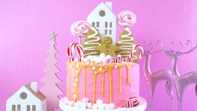 Candyland fairytale style children's party Christmas cake in pink and gold table setting. Dolly turning shot. - Powered by Shutterstock - Get 15% off with code: PIKWIZARD15