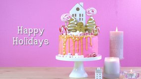 Candyland fairytale style children's party Christmas cake in pink and gold table setting, with animated Happy Holidays text greeting. - Powered by Shutterstock - Get 15% off with code: PIKWIZARD15
