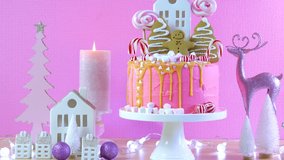 Candyland fairytale style children's party Christmas cake in pink and gold table setting. Pan across. - Powered by Shutterstock - Get 15% off with code: PIKWIZARD15