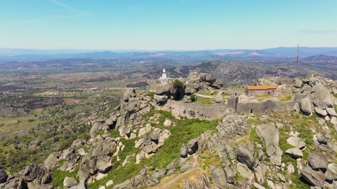 Aerial view of small rural castle located in mountains. Top View of Monsanto castle in central Portugal
