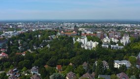 Aerial view of the city Darmstadt in Germany. On a sunny day in Summer. Descending beside the city.