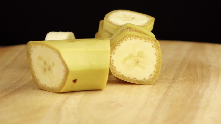 sliced banana rotates 360 degrees on wooden platform