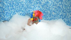 Cute clown man in the bath with copious foam. humorous concept. - Powered by Shutterstock - Get 15% off with code: PIKWIZARD15