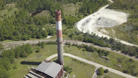 A large smoke stack at a long abandoned factory.