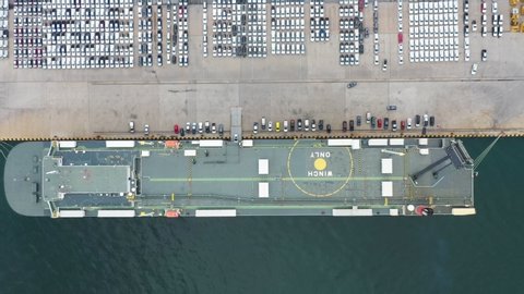 Aerial view ro-ro ship, transportation of business logistic sea freight, New Cars produced by year up in the port for Cargo ship and Cargo import-export around in the world