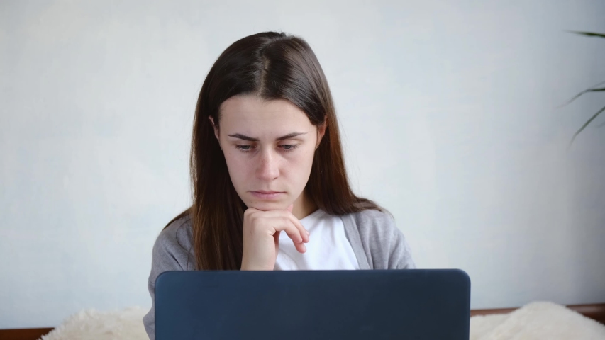 Young attractive woman rubbing eyes, feeling exhausted after long working day with computer, suffering from eye strain, blurred vision, dry eyes syndrome. Work process at home concept. Royalty-Free Stock Footage #1040445059