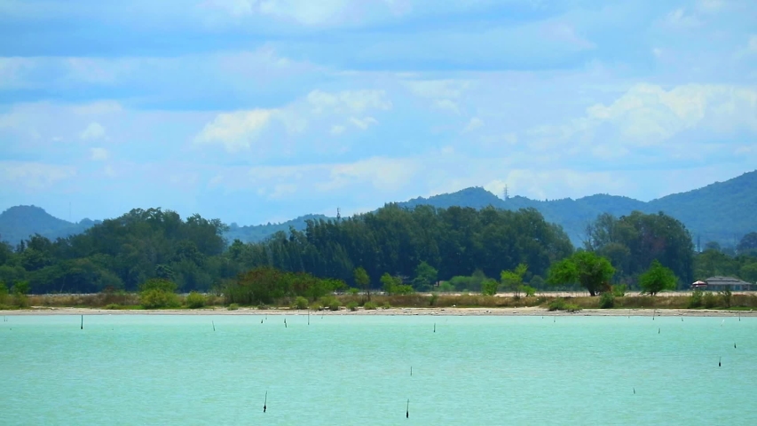 heat air on lake blue sky white cloud move over hill background