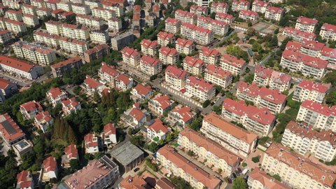 Tilted aerial view of popular residential neighborhood in suburbs of Qingdao, daily life in apartment buildings in China