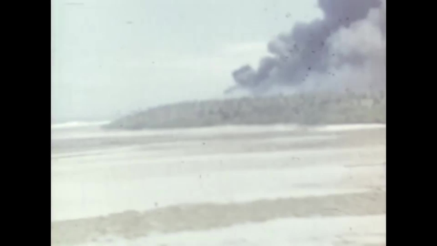 CIRCA 1940s - A fire burns in a jungle on Kwajalein during World War 2.