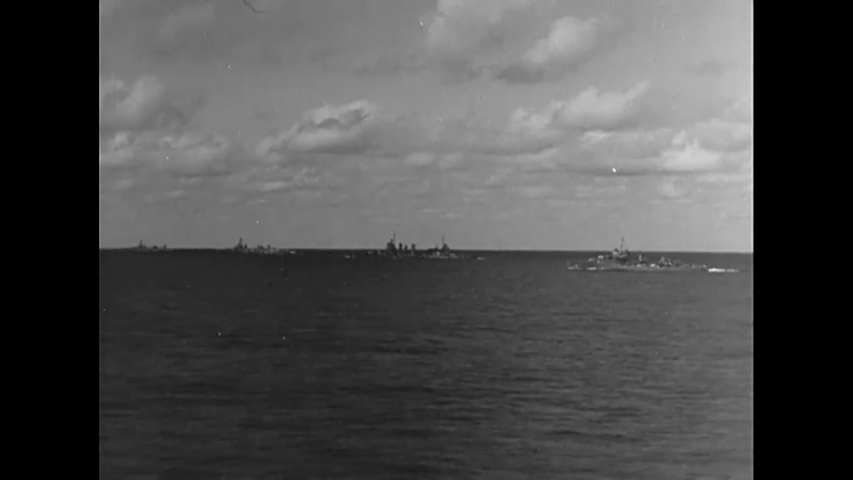 CIRCA 1942 - US Navy planes fly in formation over a task force in the Pacific.