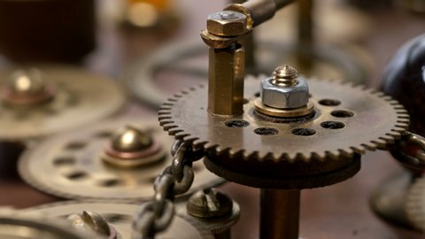 close-up spinning gears, Very similar to a clock mechanism or a working device in the old style. 4K Video stock