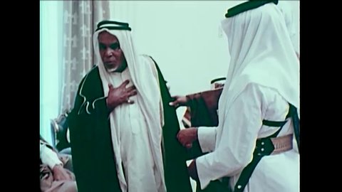 CIRCA 1980 - Saudi Arabian princes meet and pray in the desert.