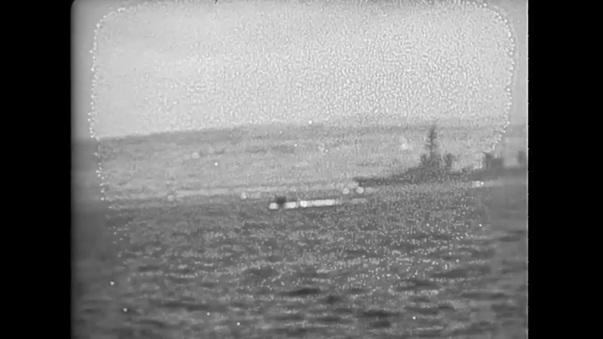CIRCA 1945 - US Navy landing crafts are shown approaching Okinawa. Royalty-Free Stock Footage #1040486678