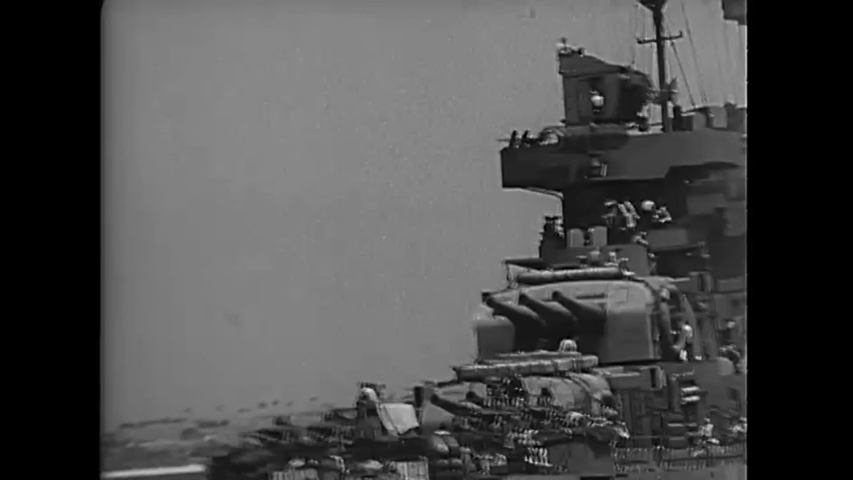 CIRCA 1945 - A US Navy battleship leads a convoy towards Okinawa. Royalty-Free Stock Footage #1040486681