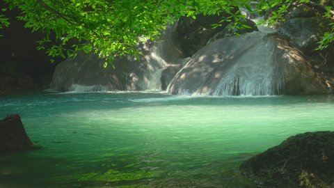  Beautiful Erawan waterfall in the tropical rain forest Erawan National Park, Kanchanaburi, Thailand            