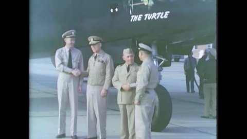 CIRCA 1946 - Rear Admiral Hardison, Captain Barbaro, and crewmen stand before and inspect the P2V Truculent Turtle at Patuxent River Naval Station