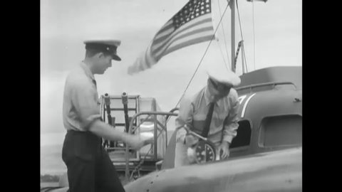 CIRCA 1942 - US Navy sailors examine a torpedo and undergo turret training.