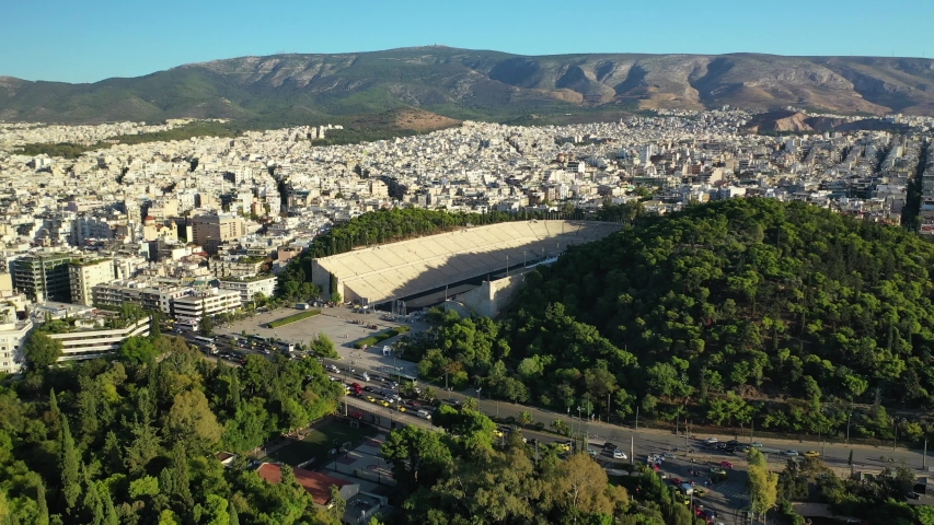 Aerial drone video of iconic symmetrical landmark Panathenaic stadium or Kalimarmaro where classic Olympic games used to take place, Attica, Greece
