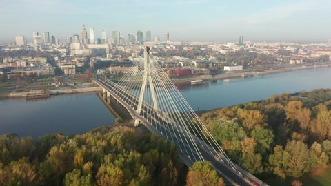 Warsaw Poland. Aerial view of cityscape with bridges and river at sunrise on a foggy morning. Drone landscape shot in the city.