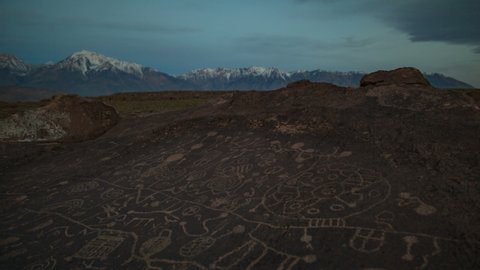 Time lapse of morning sun illuminating ancient Native American petroglyphs in Eastern Sierra, California 