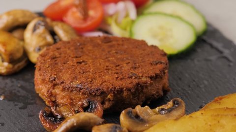 Plant based vegan burger meat, fake vegeterian beef meat close up, fresh impossible veggie food, beyond meat