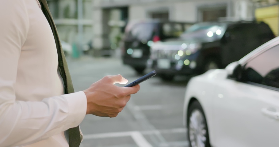 Asian businessman unlock door of car by using smart phone | Shutterstock HD Video #1040507345
