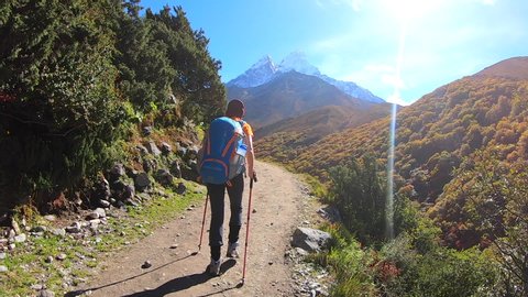 Hiking forward by the trail  way to Everest base camp, Nepal, Pov action camera view