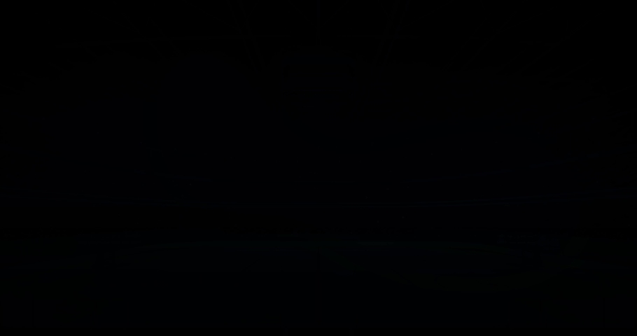 Lighting the ice hockey rink before the game in the stadium full of fans, 4k advertisement background animation