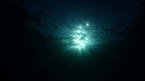 sun ray and sun beam scenery underwater waves on surface of water slow ocean scenery backgrounds Arkivvideo