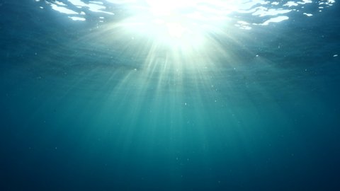 sun ray and sun beam scenery underwater waves on surface of water slow ocean scenery for background
