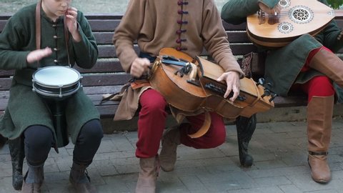 Moscow, Russia - June 13, 2019: Times and Epochs Festival. Street musicians dressed in vintage ethnic oriental clothes play music on traditional Middle Eastern musical instruments turkish darbuka