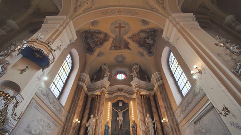 Lida, Belarus - August 4, 2019: The interior of the catholic church. Video on the move.