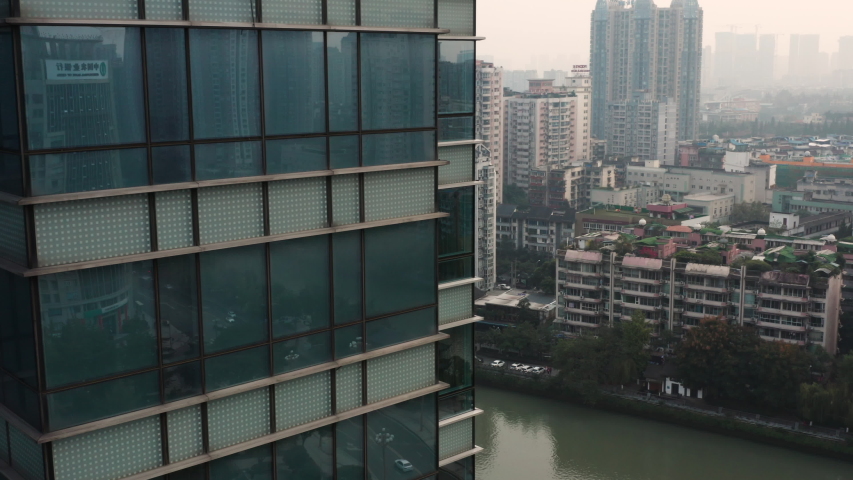 Aerial view of the Anshun Lang Bridge with the Jinjiang river surrounded by lot of buildings in the downtown of Chengdu, China