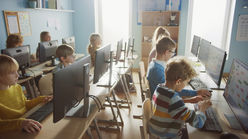Elementary School Computer Science Classroom: Diverse Group of Little Smart Schoolchildren using Personal Computers, Learn Informatics, Internet Safety, Programming Language for Software Coding