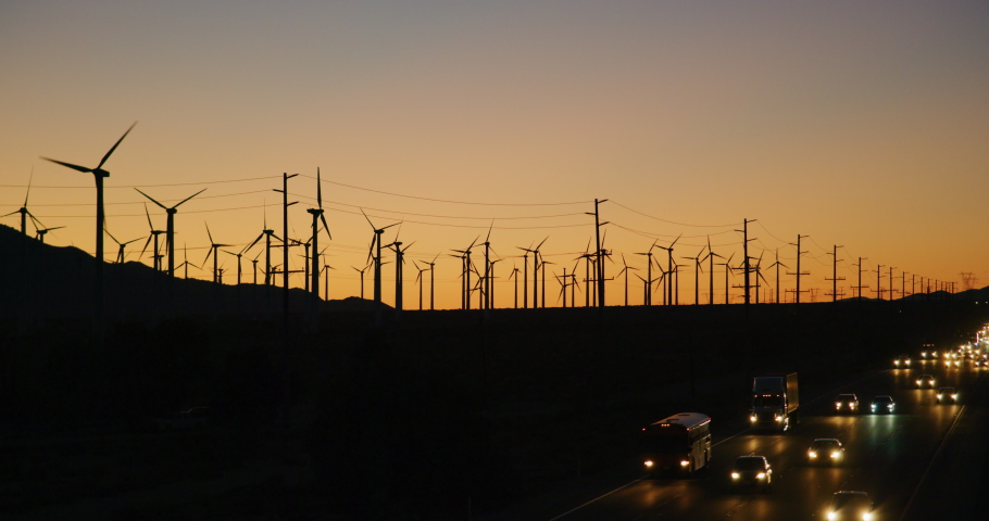 Wind turbines and traffic on I-10 highway in Palm Springs, California