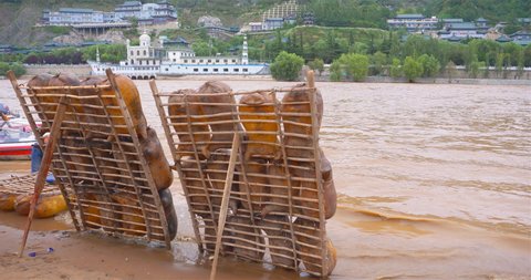 Sheepskin raft by the Yellow River in Lanzhou Gansu China