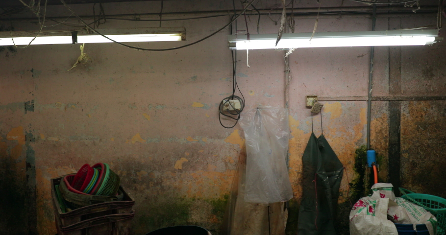 Slow motion gimbal shot of a local chicken butcher shop in Penang, Malaysia.