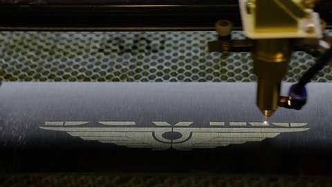 CNC engraving. Laser engraver with cnc, logo engraving laser. Laser engraving on metal