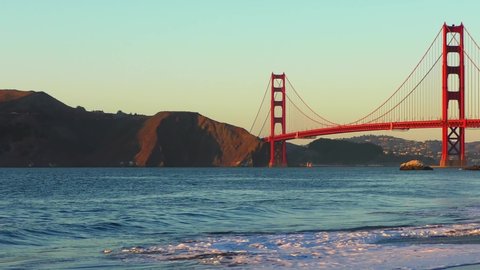 The Golden Gate Bridge as seen from Baker Beach at sunset, San Francisco, California, USA