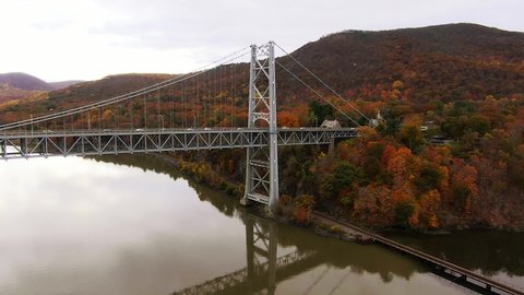 Aerial shot of Purple Heart Memorial Bridge traffic Hudson River Valley fall foliage