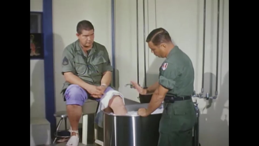 CIRCA 1960s - Patients receive hydrotherapy with physical therapists at a military hospital during the Vietnam War. | Shutterstock HD Video #1040576795