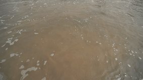 The tide of the waves of the Arabian Sea off the coast of Goa. India. Slow motion view.