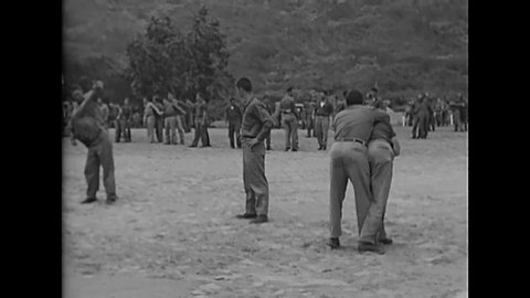 CIRCA 1940s - Soldiers train judo in the jungle, World War II
