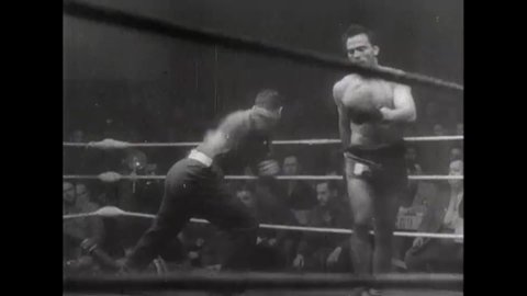 CIRCA 1940s - Newsreel footage of boxing matches by and for members of the American military during World War II
