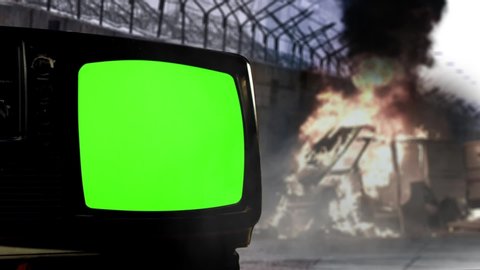 Retro TV with Green Screen, a Car on Fire and the Berlin Wall. You can Replace Green Screen with the Footage or Picture you Want with “Keying” effect in AE (check out tutorials on Youtube).