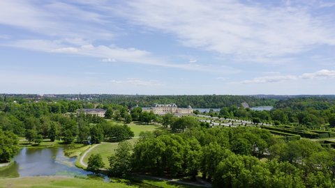 Stockholm, Sweden - June 23, 2019: Drottningholm. Drottningholms Slott. Well-preserved royal residence with a Chinese pavilion, theater and gardens, Aerial View Hyperlapse, Point of interest