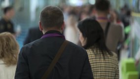 Crowd of people walking indoors, defocused, faces are not recognized - Powered by Shutterstock - Get 15% off with code: PIKWIZARD15