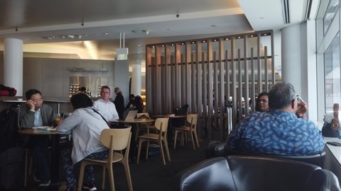 Sydney, NSW / Australia - Oct 17 2019:  people passenger relaxing at the Qantas International Lounge at the Sydney Kingsford Smith airport (SYD). Qantas (QF) is a member of the OneWorld alliance