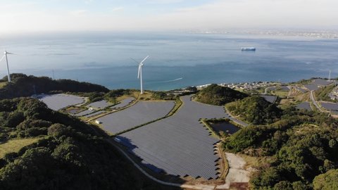 4K Aerial Drone Footage of Wind Turbine, Solar Panel, Ocean, and Ship, Nojima-Tokiwa, Awaji, Hyogo, Japan.